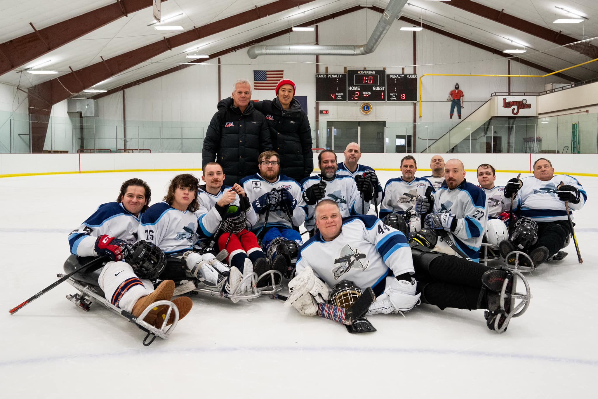 Sled Hockey - Syracuse Area Team - Seth Gitner (with beard in middle), SUMH Faculty Advisor